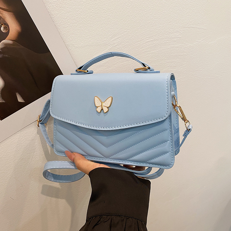 Bolso bordado de color sólido otoño y invierno 2024 nuevo estilo retro bolso de moda simple bolso de mariposa de moda