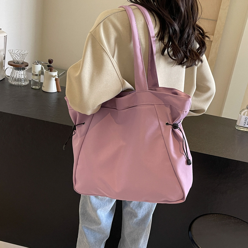 Bolso casual coreano de moda de gran capacidad de color puro 2024 primavera nuevo bolso de axila de un solo hombro ins de todo fósforo