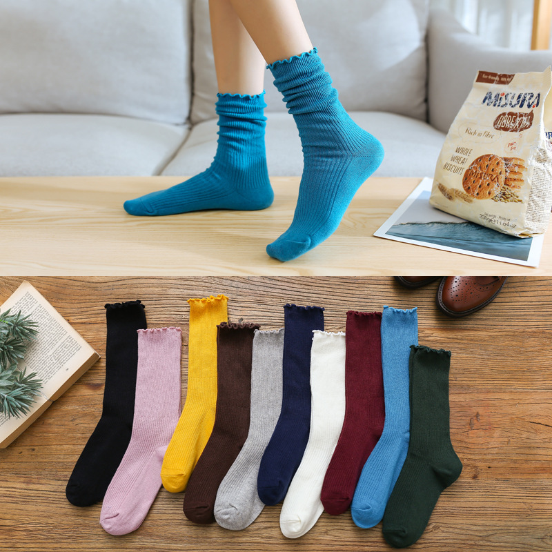 Primavera y otoño de las mujeres delgadas de algodón oreja de madera doble aguja pila calcetines japoneses retro color sólido ins largos calcetines casuales al por mayor