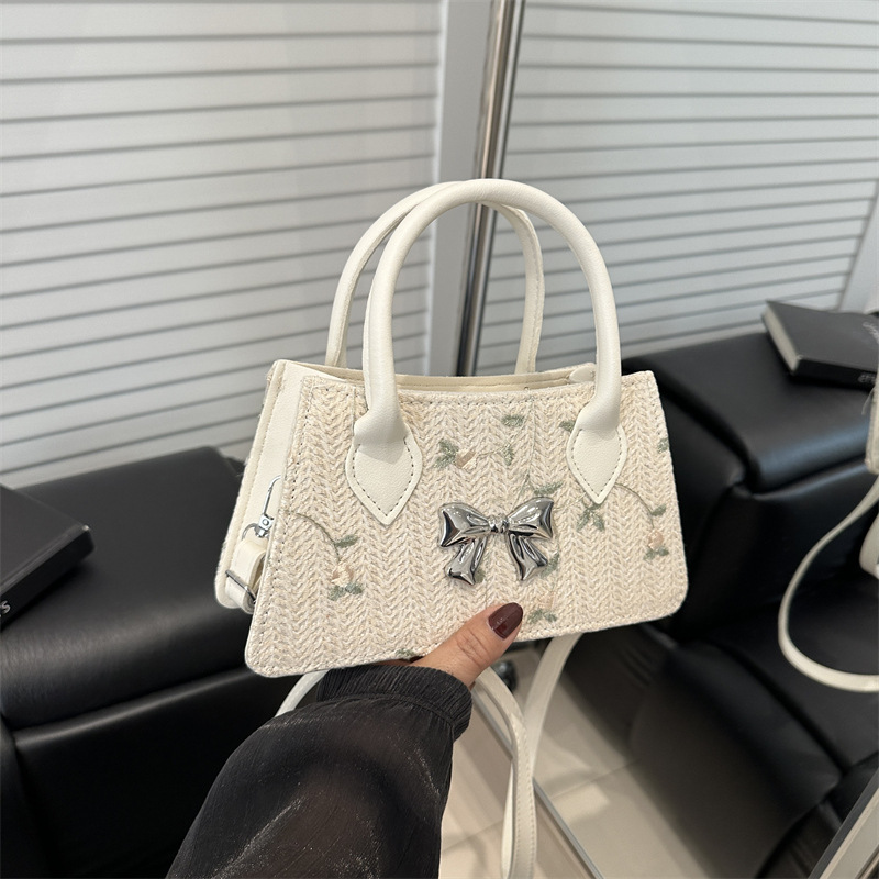 Moda de tejido de paja de primavera y verano 2025 nueva tendencia de encaje de paja estilo occidental bolso de mensajero de un solo hombro femenino
