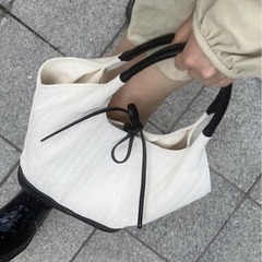 韓国ニッチハイエンドレトロバッグ女性の夏 2025 新しいスプライスキャンバストートバッグ通勤ハンドバッグ