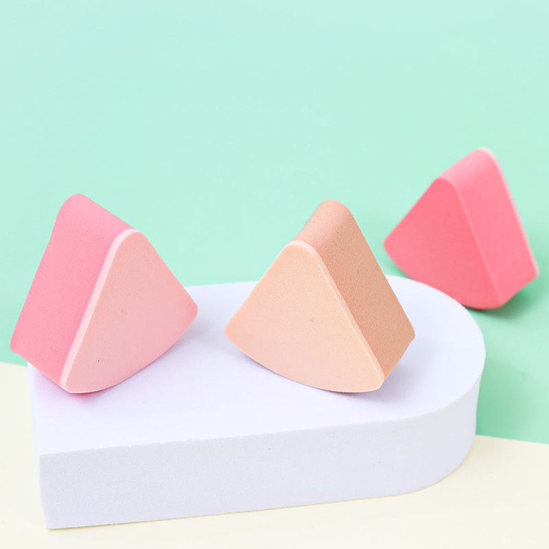 Fábrica personalizada de polvo de esponja triangular no comer polvo seco y húmedo de doble uso en agua de remojo para aumentar el maquillaje no látex de gel de goma cosmética
