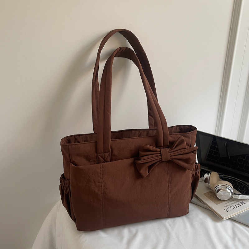 Bolso de lazo retro simple y ligero de color sólido bolso especial de costura de coche de moda femenino bolso de ropa de algodón de textura de hombro único bolso de moda