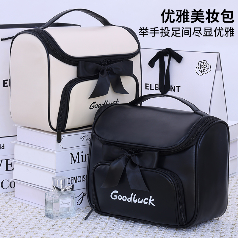 Luz lujosa pequeña fragancia arco bolsa de maquillaje mujer gran capacidad de viaje portátil división impermeable bolsa de almacenamiento de lavado de alto nivel