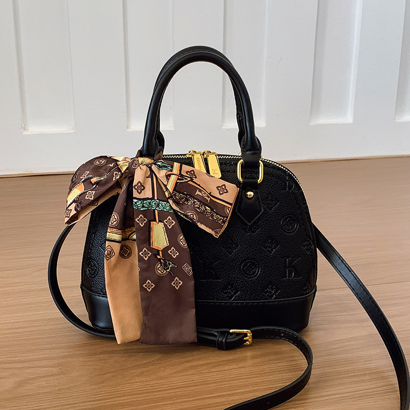 Borsa a tracolla da donna di alta gamma, nuova collezione 2025, con design a conchiglia in rilievo, elegante e morbida, ideale per il trasporto transfrontaliero._voghion.com