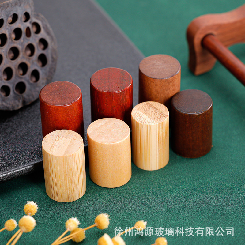 Venta al por mayor directa de fábrica en stock bayoneta botella de perfume cilíndrica multicolor cubierta de madera cosméticos cubierta de palo de rosa