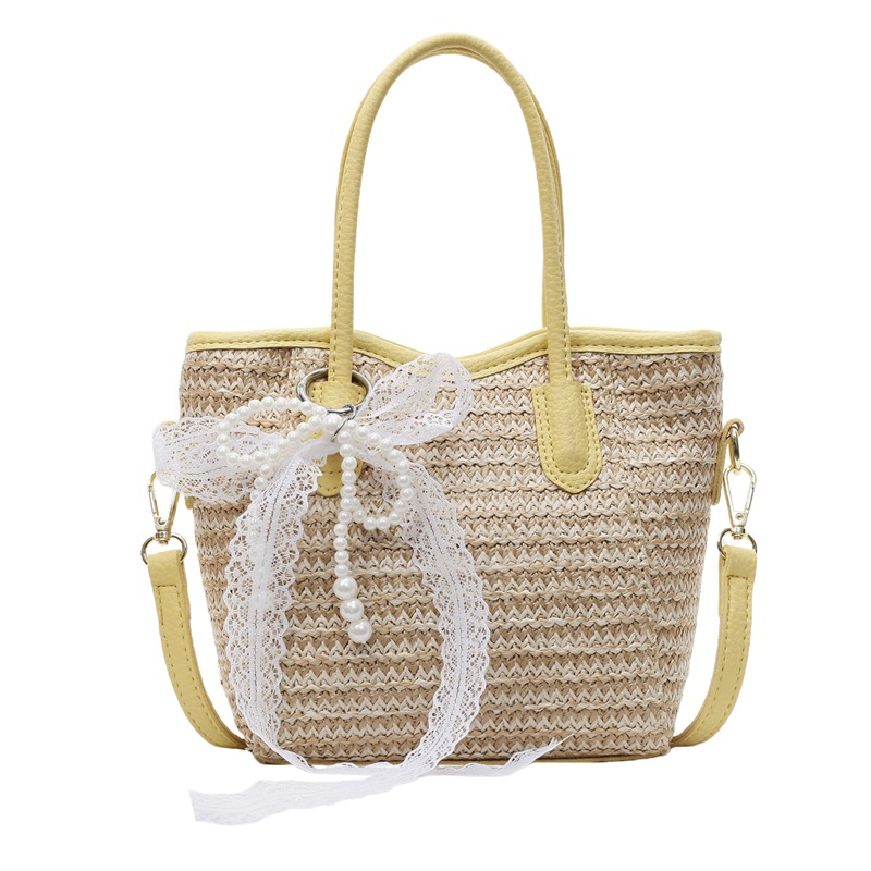 Bolso de cubo portátil de paja de gran capacidad de tendencia para mujer 2025 nuevo bolso de mensajero de hombro de moda de viaje de vacaciones en la playa