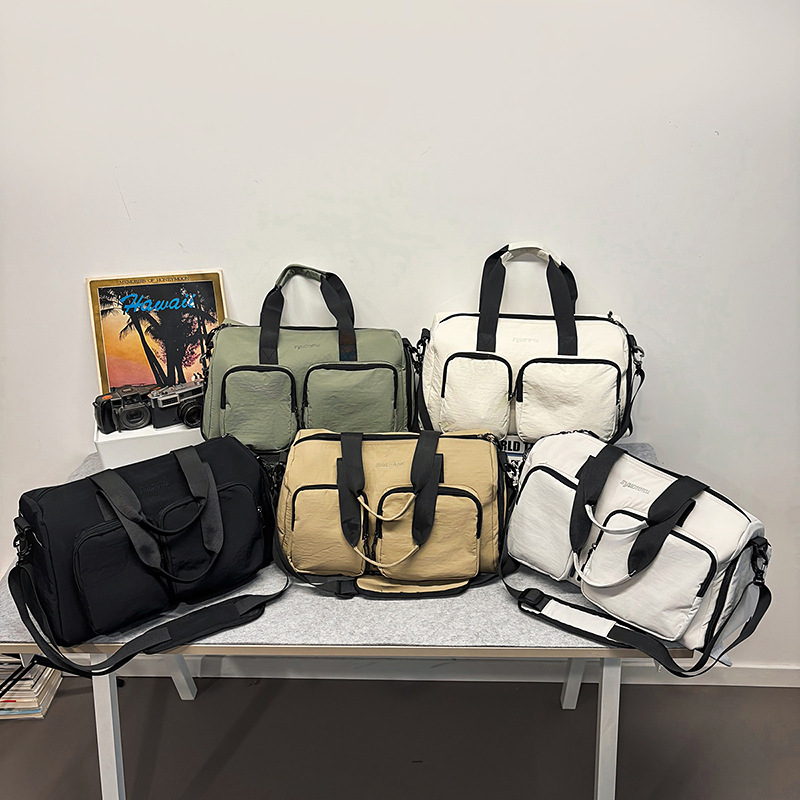 Bolsa deportiva de acondicionamiento físico de gran capacidad para mujeres bolsas de viaje corto bolsas de mano 2025 nuevas bolsas domésticas almacenables