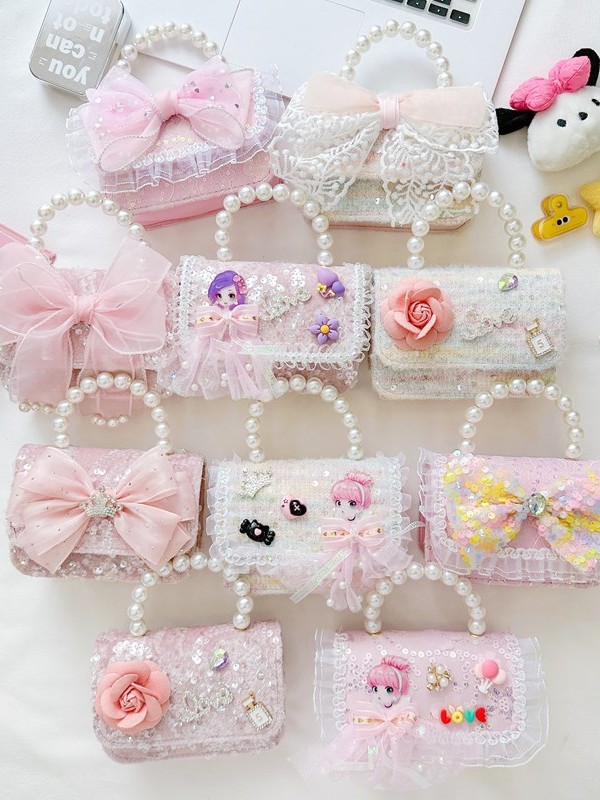 Nuevo bolso infantil de moda de otoño bolso de mochila para chicas bolso portátil de perlas princesa pequeña fragancia bolso de cambio al por mayor