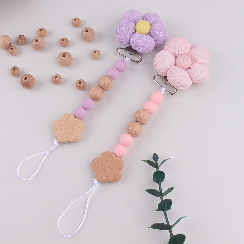 Productos para bebés pacificadores de tetas anti-caída cadena INS cadena de diente de viento flor de madera