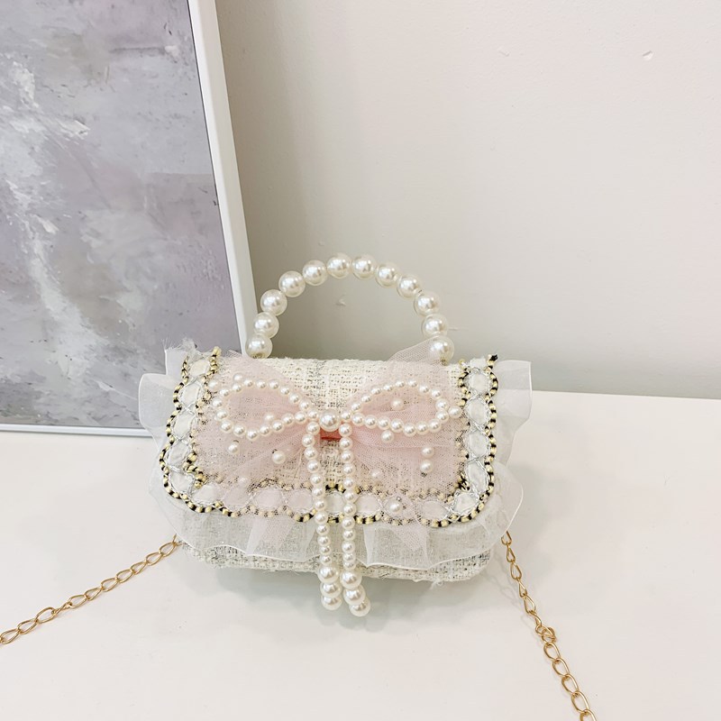 Bolsa de hombro coreana para niñas, arco de perlas, lindas flores, bolso de mochila para bebés, nuevo tipo de bolso para niños fragante.