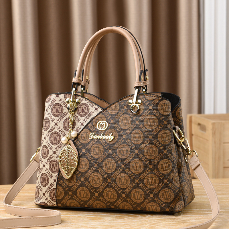 Bolso bandolera para mujer nuevo versátil bolso de mamá moda de verano bolso de mano de un solo hombro 2025 fabricante comercio exterior elegante para mujer.