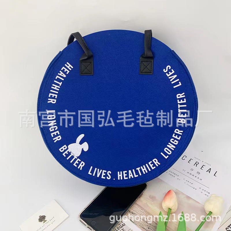 新款简约字母圆形毛毡包日常通勤百搭手提包时尚存敞口单肩包