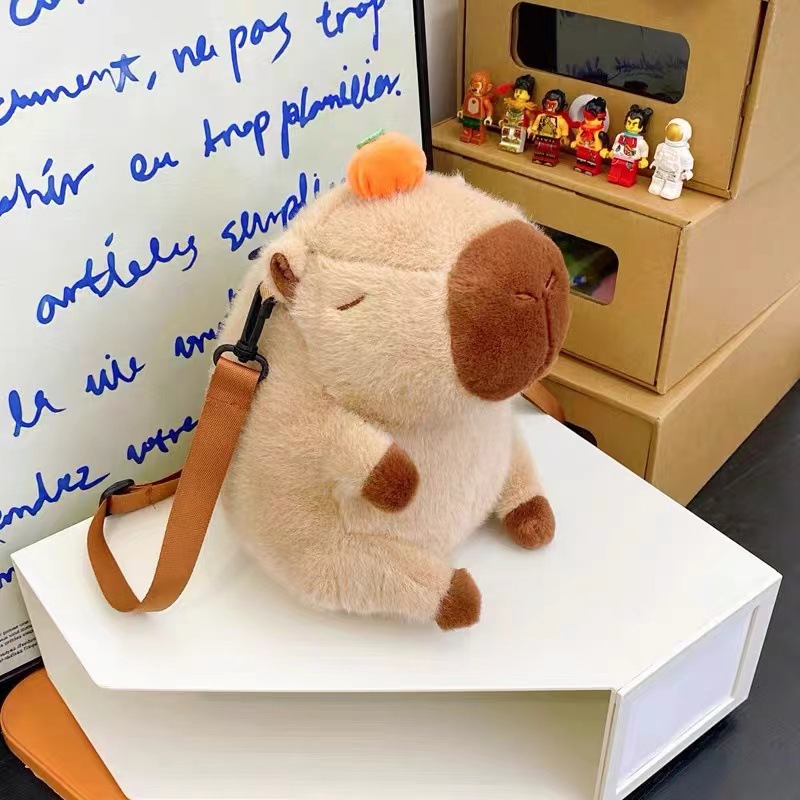 Venta directa de fábrica: bolsas de maquillaje de dibujos animados, muñecos de peluche, juguetes portátiles para niños, bolsos para mujer, muñecos de máquina de garras y otros productos.