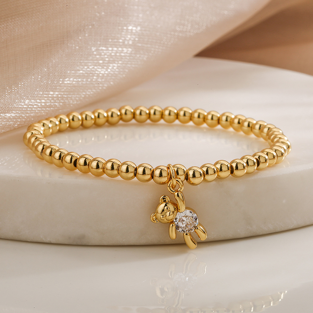 Bracciale con pendente orsetto e perline in rame e zircone donna_voghion.com