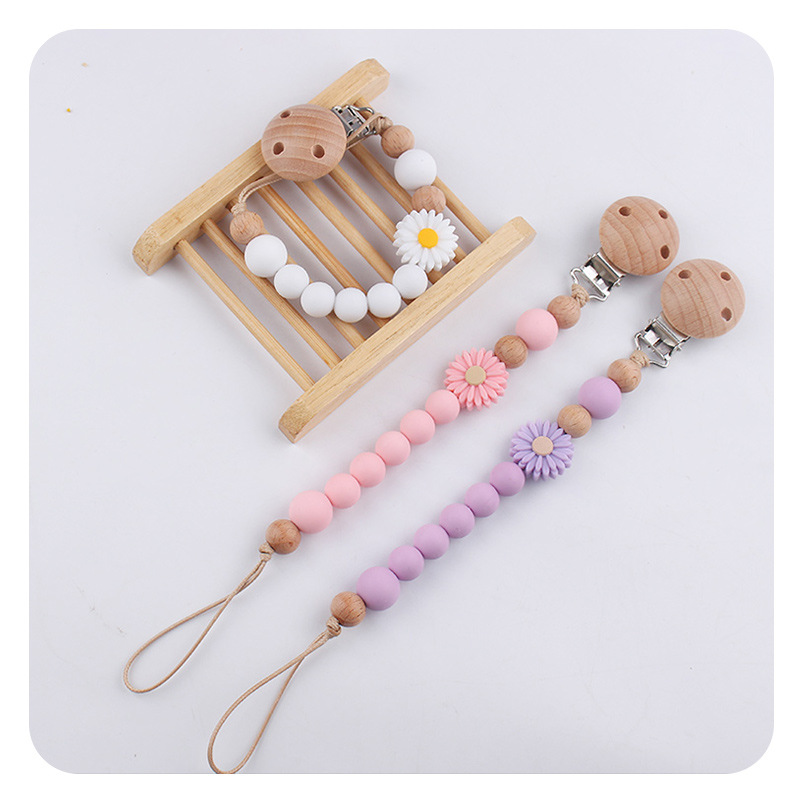 Productos para bebés de madera de haya cadena de tetas de silicona de dibujos animados margarita cuentas para calmar bebés cadena de tetas anti-caída cadena