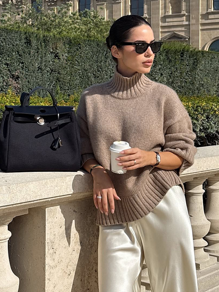 Simple estilo de alta sensación suelta de cuello alto color sólido suéter de manga larga para mujeres 2025 otoño y invierno nuevo estilo transfronterizo europeo y americano
