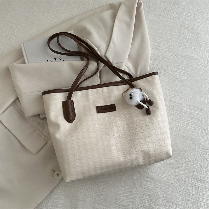 Bolso de mano de viaje al trabajo 2024 primavera nuevo bolso de ocio universal bolso de hombro brazo bolso de mano coreano