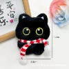 Big-eyed full-body black cat with patterned scarf