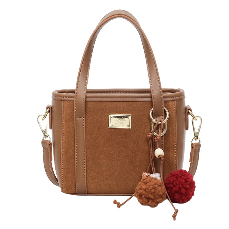 Bolso coreano retro de alta calidad bolso de cubo de agua mujer otoño / invierno 2025 nuevo simple bolso de hombro mochila casual