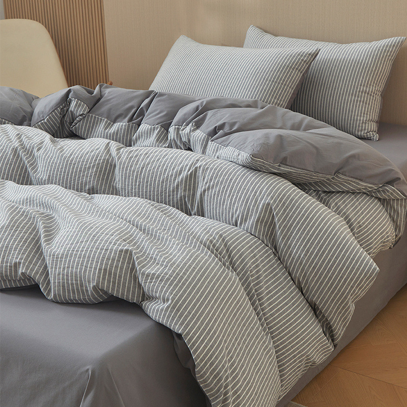 Nuevo traje de cama de algodón lavado de algodón de cuatro piezas de algodón 2025 nuevo traje de dormitorio de funda de edredón de sábana simple de tres piezas