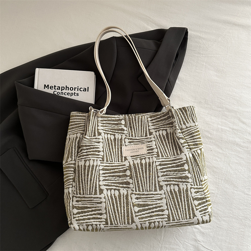 Bolso a rayas casual de todos los partidos de nicho para mujer 2024 nuevo bolso de hombro de gran capacidad de moda retro bolso de viaje