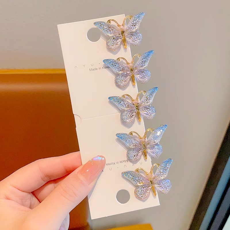 Estilo explosivo Super Fairy Symphony Horquilla de mariposa tridimensional Clip de pelo roto femenino Tocado Clip de pico de pato Horquilla para niños con sentido avanzado