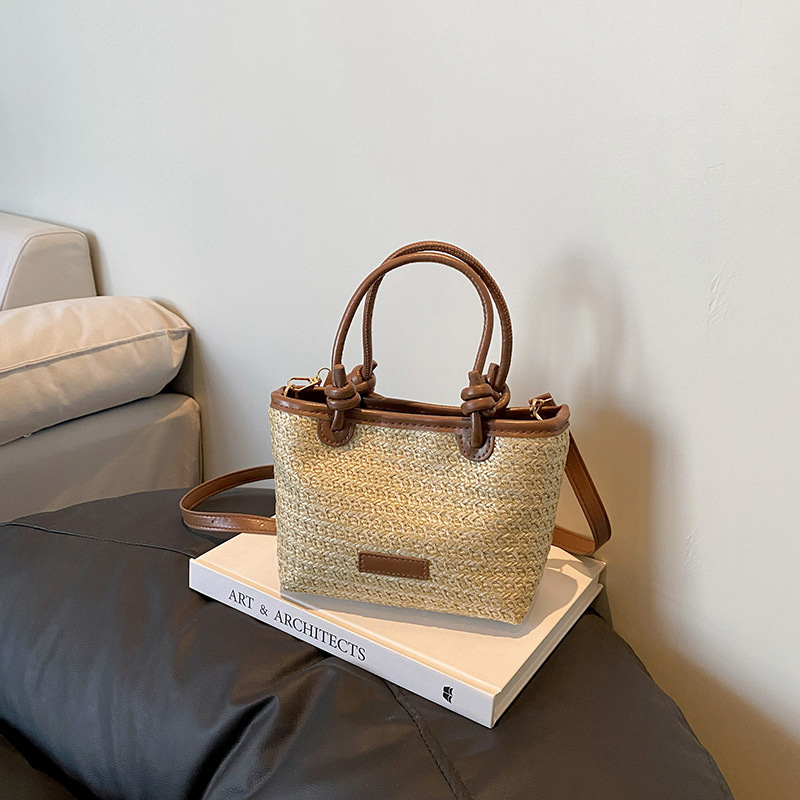 Bolso tejido estilo playa de vacaciones de primavera y verano bolso de mensajero portátil 2025 nuevo estilo nudo de cuerda de aire extranjero bolso de canasta de verduras bolso tejido