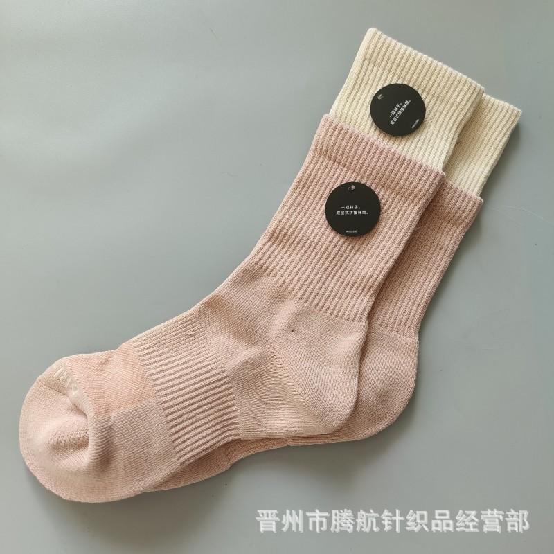 蘇万ナイキの靴下のカラーの二重は男女の中で長い筒のタオルの底のスポーツの靴下をつなぎ合わせてバスケットボールの靴下を走ります。