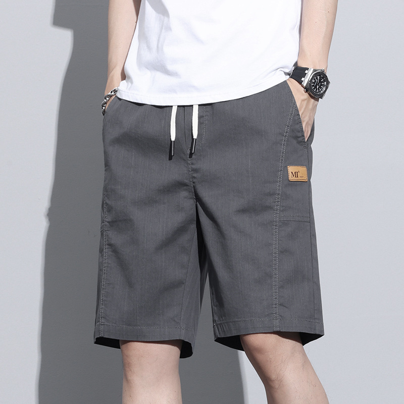 Pantalones cortos de seda de hielo para niños pantalones casuales transpirables delgados de verano 2025 nuevos pantalones de cinco puntos sueltos rectos para hombres