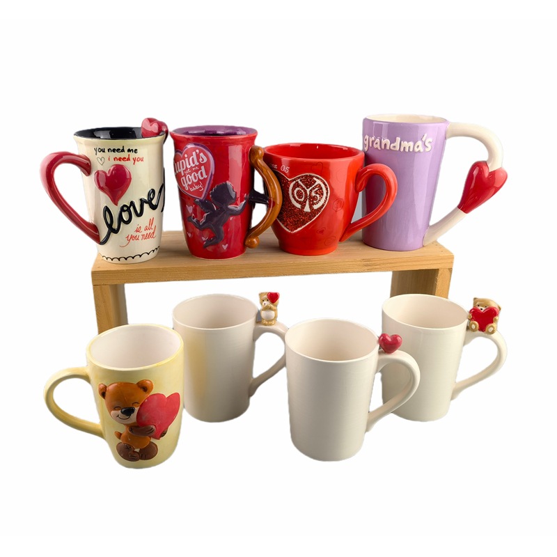 Tazas en forma de corazón de cerámica Tazas de agua de pareja Tazas creativas del día de San Valentín de Cupido Tazas de café con mango de amor rojo