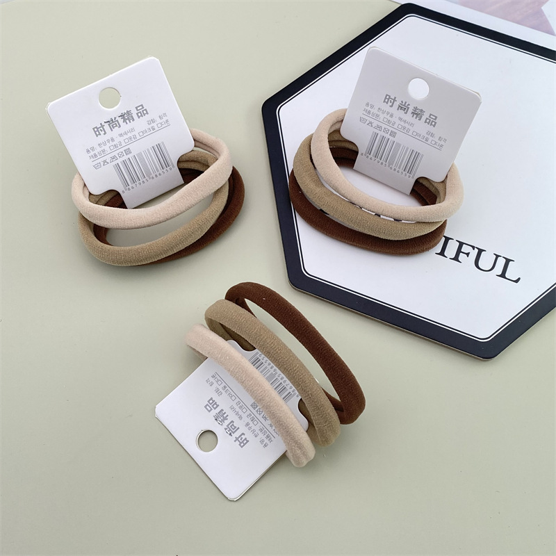 Estilo coreano accesorios para el cabello etiqueta simple leche té pelo cuerda 3 tarjetas grandes sin costura diadema 2 yuanes tienda tocado
