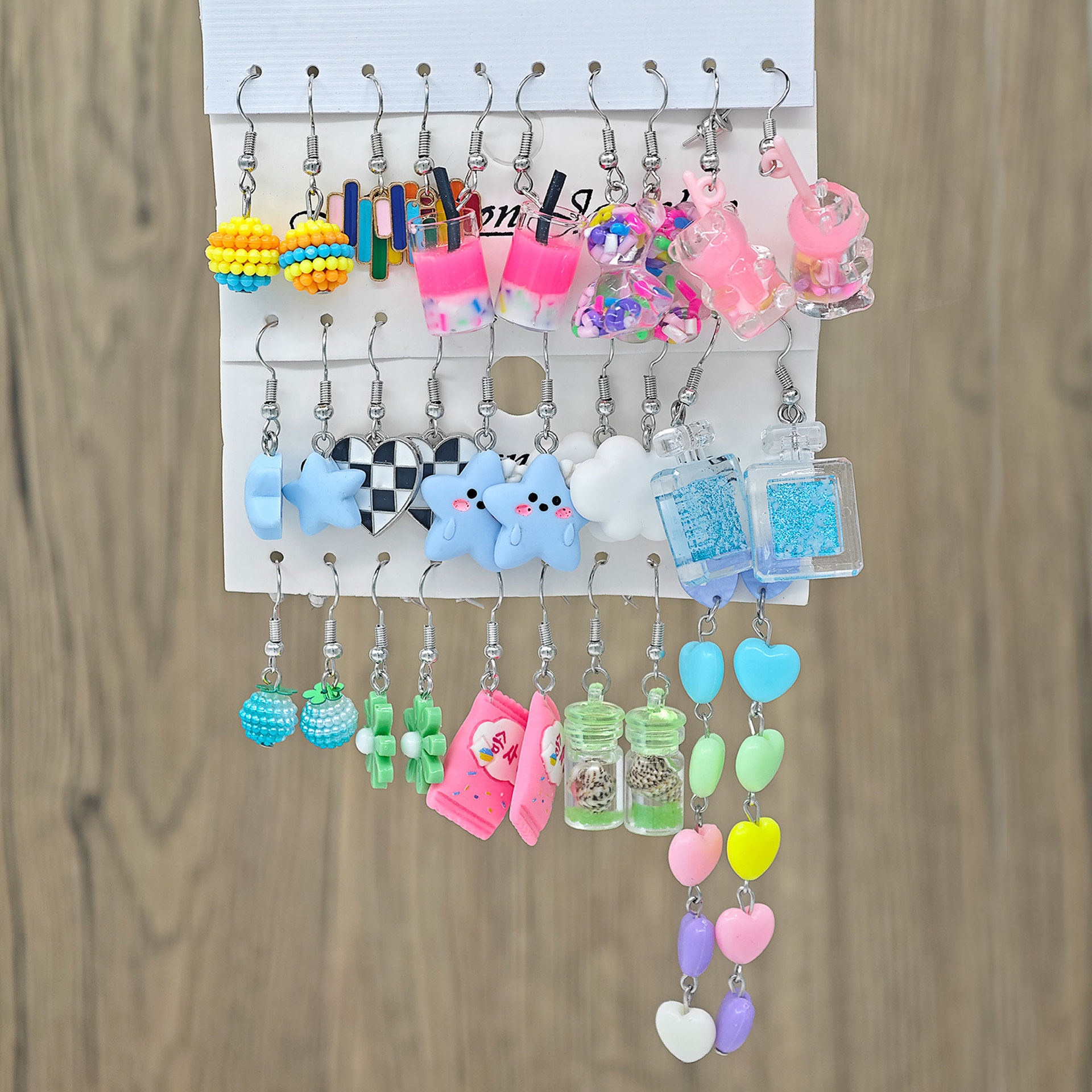 Moda transfronteriza de venta caliente de dibujos animados animales de caballo blanco resina de margarita simulación de alimentos donut auriculares multi-pieza conjunto