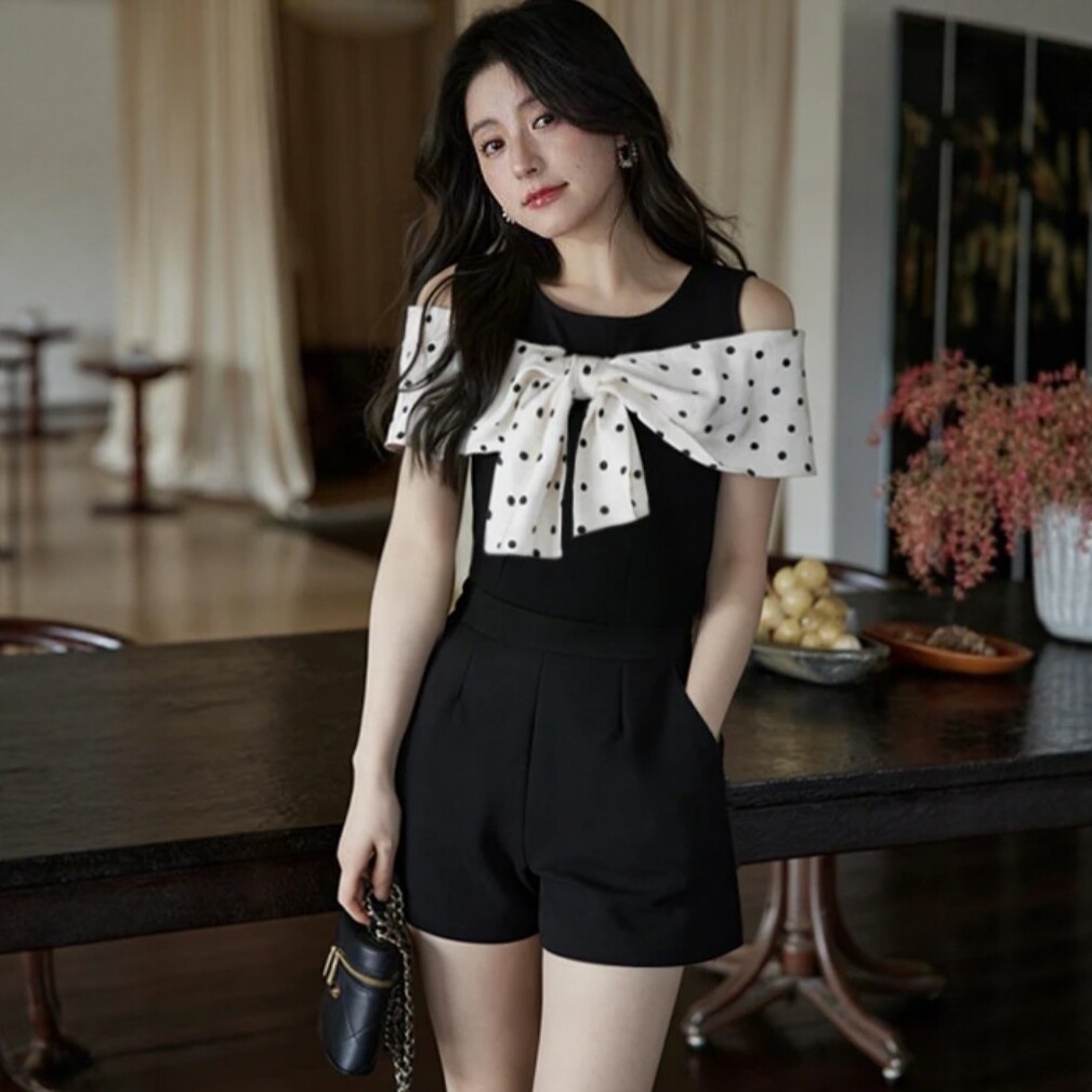 New summer style black jumpsuit for women, Korean style, sleeveless, bow-tie polka dot design, slim fit and flattering.