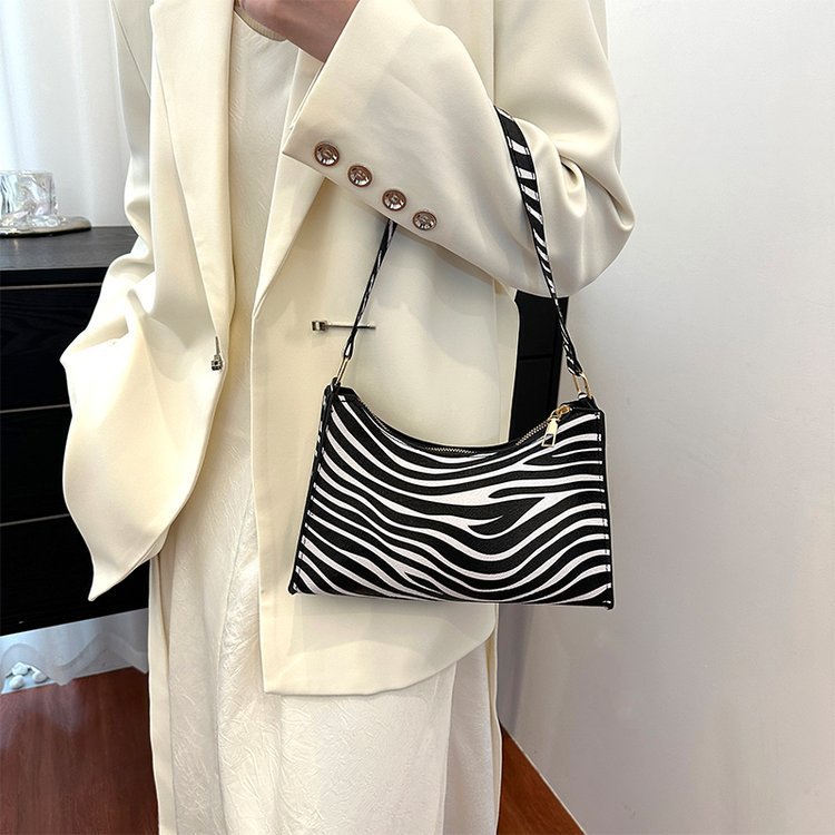 2024 nuevo bolso de axila con estampado de leopardo de moda popular de todos los partidos Bolso de hombro portátil para mujer casual retro europeo y americano