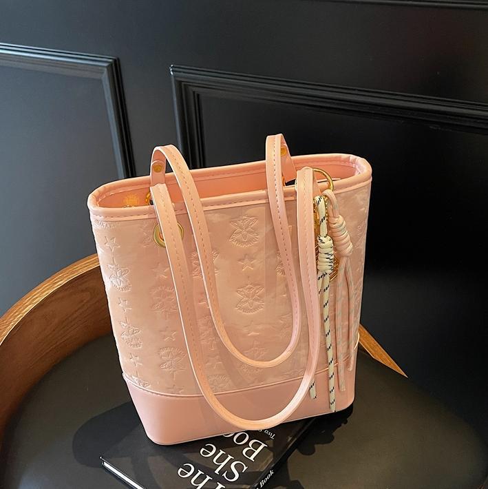 Bolsa de cubo de moda coreana para mujeres 2025, nuevo diseño universal de nicho para viajar bolso de hombro de moda bolso de mujer casual