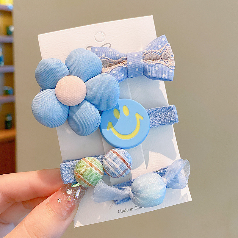 Juego de 5 piezas de cara sonriente de viento azul