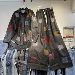 韓国東大門の新型重工のカラーはドリルを貼ってやせている上着のファッション的なひもの広い足のズボンのスーツを現します。
