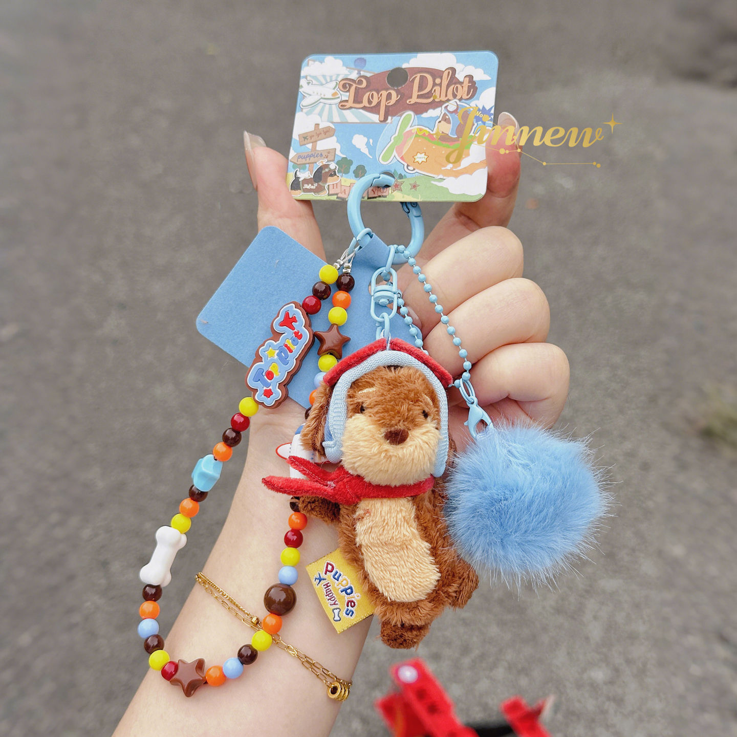 Tercera generación de Papis salchicha perro ace piloto cadena de teléfono móvil colgante de peluche lindo llavero de perro al por mayor