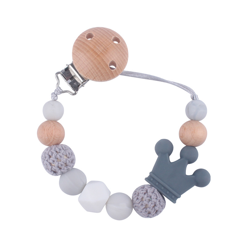 Suministros para bebés calmante clip de chupete de haya bebé anti-caída de la cadena de dibujos animados corona de silicona perlas mordedura molar chupete cadena