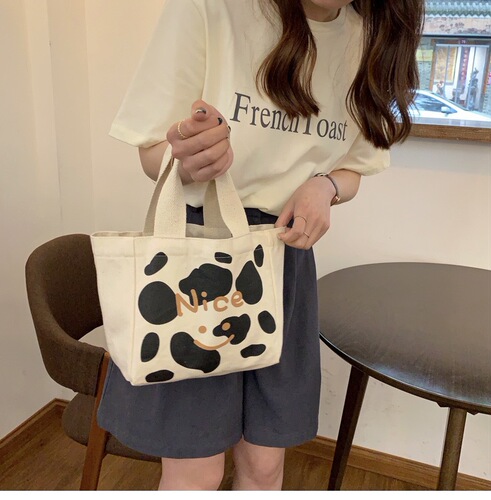 Japanese and Korean style lunch box, work bag, original cow pattern canvas bag, forest style small shoulder bag, lunch bag, ins high value