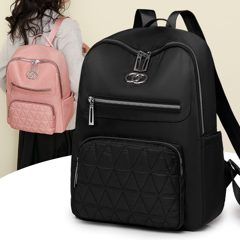 Mochila de mujer salvaje 2024 nueva mochila de viaje resistente al desgaste impermeable de gran capacidad bolsa de nailon al por mayor