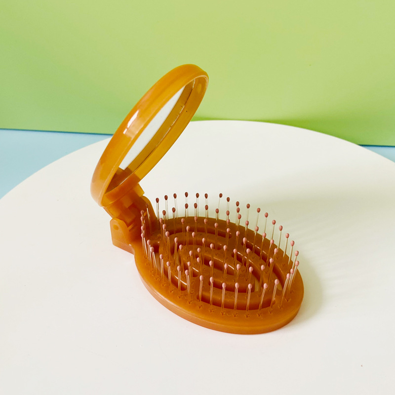 Hogar portátil de viaje cojín de aire peine hueco plegable masaje peine mini hueso contar peine pequeño con espejo al por mayor