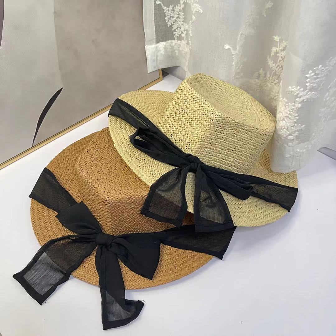 A female hat with a spring and summer ribbon, butterfly sash, hexagonal straw hat, Korean street style, anti-ultraviolet sun hat, and a wide-brimmed hat detail image 2