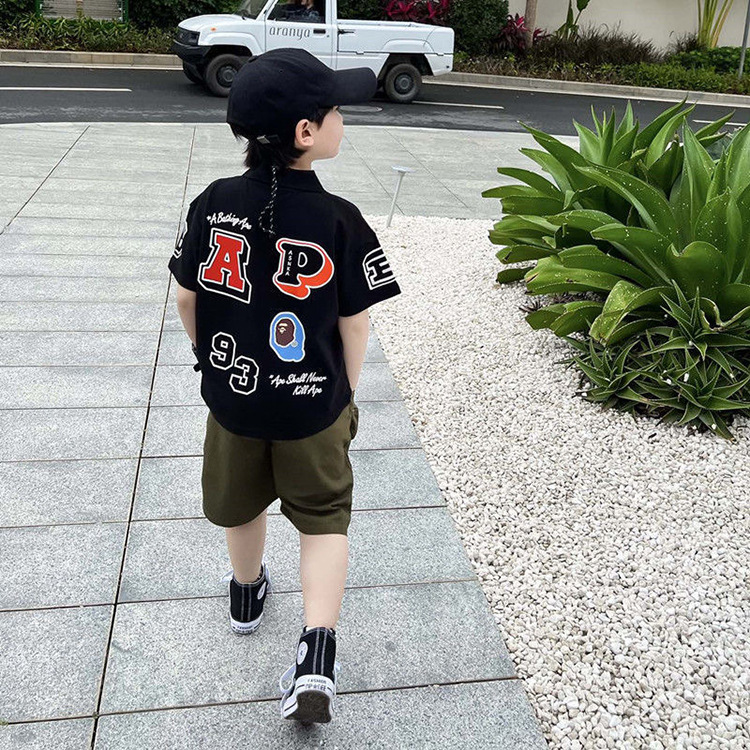 2023 Summer New Boys' Trendy Brand Letter Polo Shirt Small and Medium-sized Children's Black and White Short-sleeved T-shirt Lapel Top Trendy