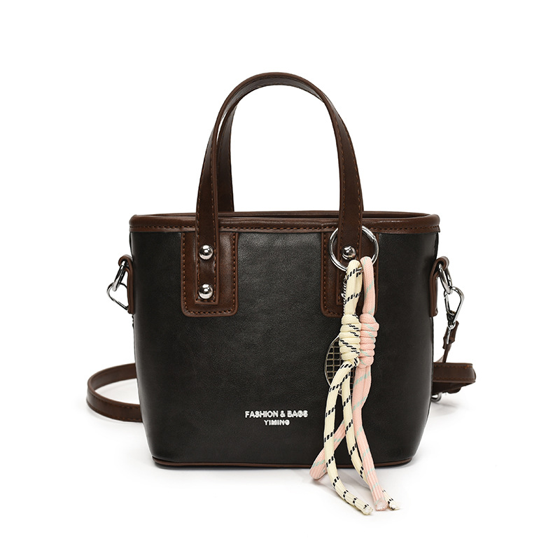 Bolso de mano de alta gama de nicho para mujer 2025 nuevo bolso de hombro de todo fósforo de color en contraste bolso de cubo de mensajero súper caliente de moda