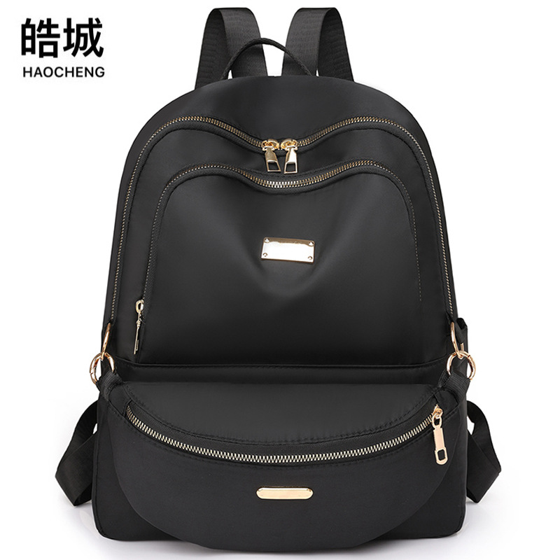 Fábrica al por mayor 2024 nueva mochila de nailon casual para mujer, mochila para madre y niño de viaje urbano de todo fósforo de moda