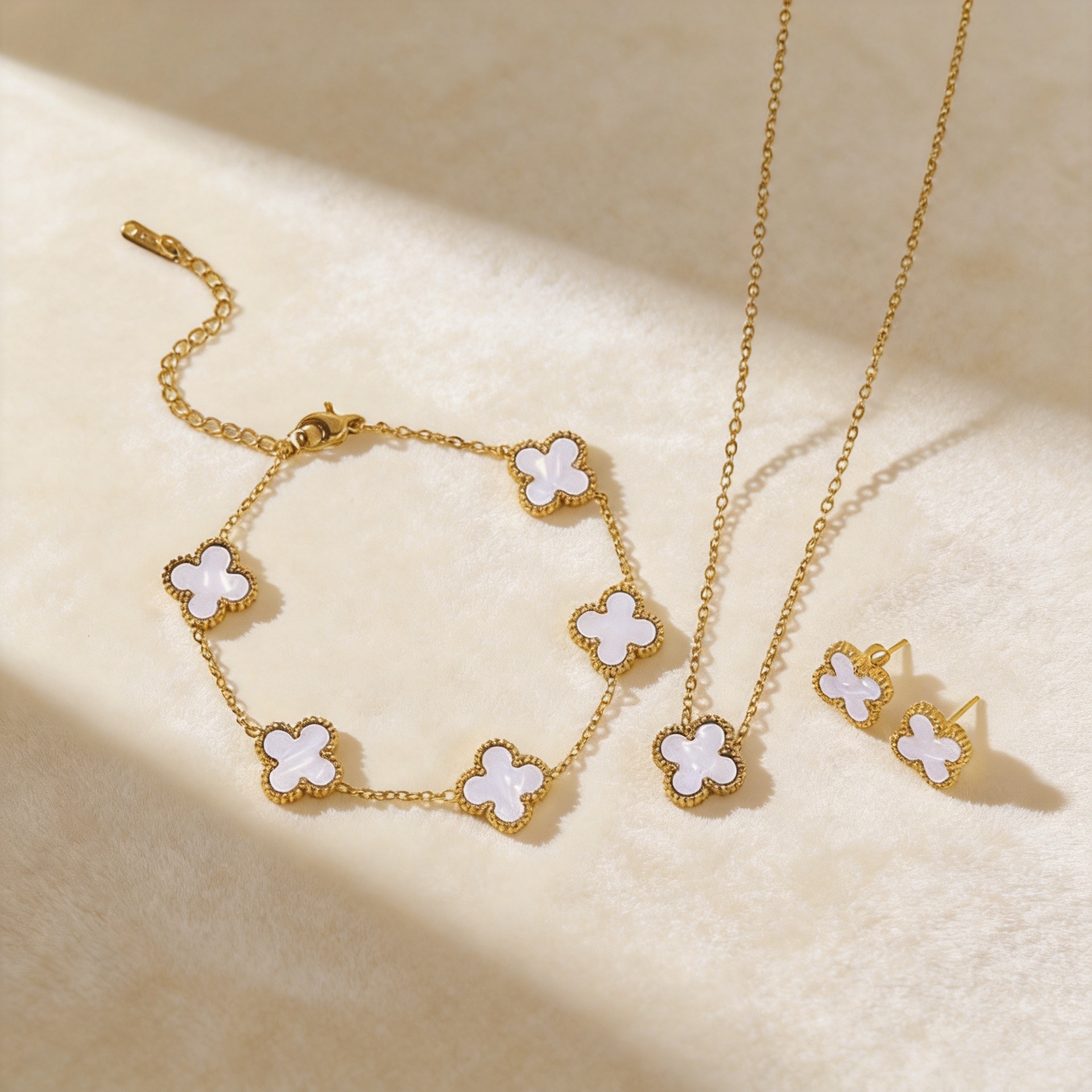 Popular 13mm four-leaf clover necklace, bracelet, and earrings three-piece set, titanium steel, non-fading, double-sided 18k gold, versatile and light luxury