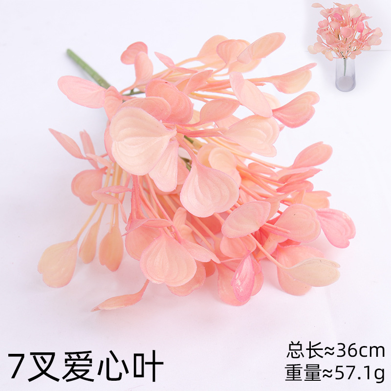 Simulación de plantas verdes flores falsas mano