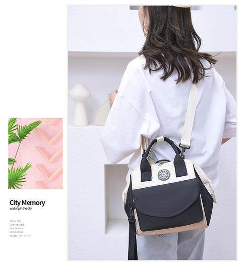 The Mommy bag is small and cute. It has a detachable front pocket and is a multi-functional baby bag. It is waterproof, lightweight, and has a crossbody design. It can be used to carry milk bags undefined
